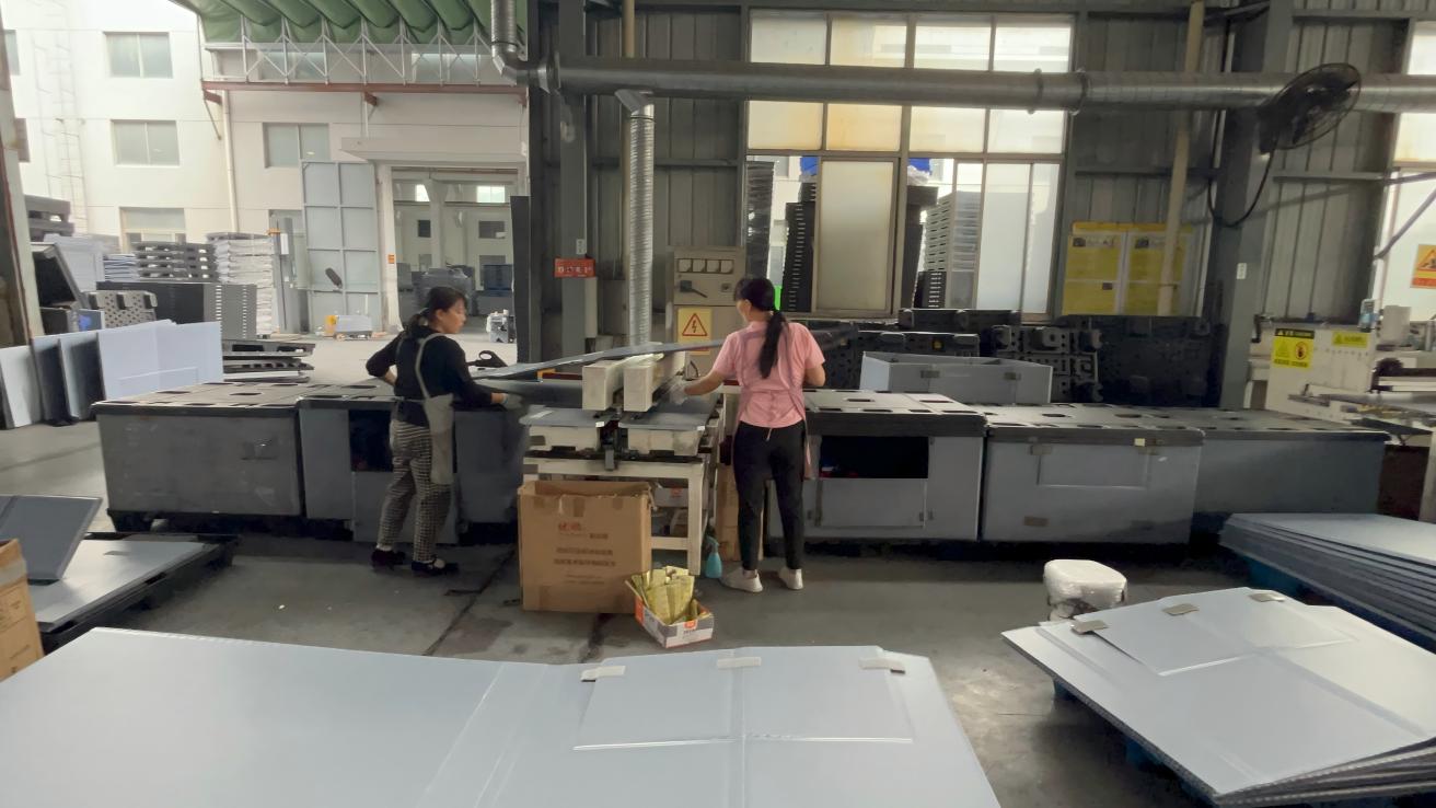 CNC machine cutting a plastic honeycomb sheet
